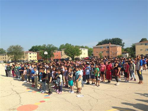 Parkwood elementary students standing for the pledge 